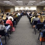 Photo of student choir singing at board meeting