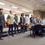 Photo of student athletes being recognized during board meeting