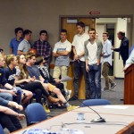 Photo of student athletes being recognized during board meeting