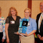 Photo of teacher receiving Sorenson Legacy Award