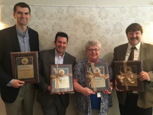 Photo of four administrators receiving awards from GASA