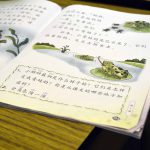 Chinese work book atop desk