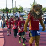 RSL mascot leading Granger students on to mini pitch