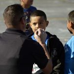 Police officer paints mustache on West Kearns student