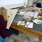 Two students working with mixed media
