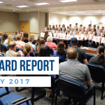 Calvin Smith students sing during board meeting and overlay text 'Board Report | May 2017'