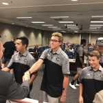 Cottonwood High baseball team shaking hands with board members