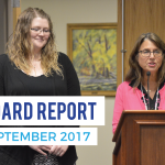 Teacher of the year being recognized at board meeting with text 'Board Report September 2017'