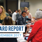 Athletes shaking hands with board members with text 'Board Report November 2017'