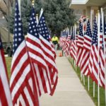 American flags line the sidewalk at Granite Park Jr High