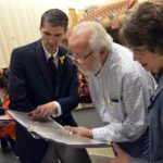 Granite Park principal shows family members of fallen soldier information on the soldier's school records