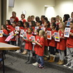 Moss Elementary students sing during board meeting