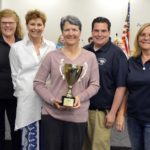 Twin Peaks Elementary staff holding trophy for highest MGP