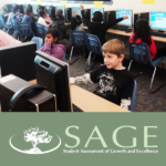 Students working at computers with SAGE logo