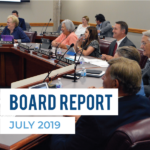 Board members at board meeting and text 'Board Report July 2019'