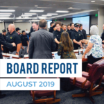 Cottonwood High students greet board members and text 'Board Report August 2019'