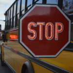 School bus with stop arm extended
