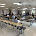West Lake student practice choir in lunchroom