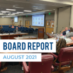 Superintendent presenting at board meeting. Text: Board Report August 2021