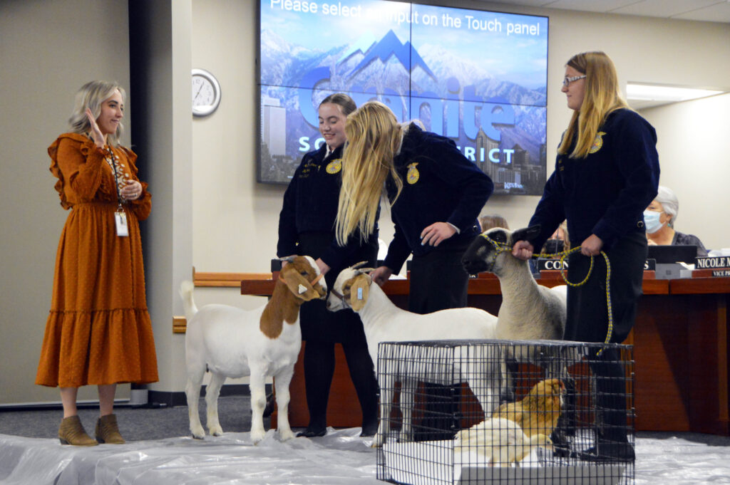 FFA members bring animals on stage at board meeting