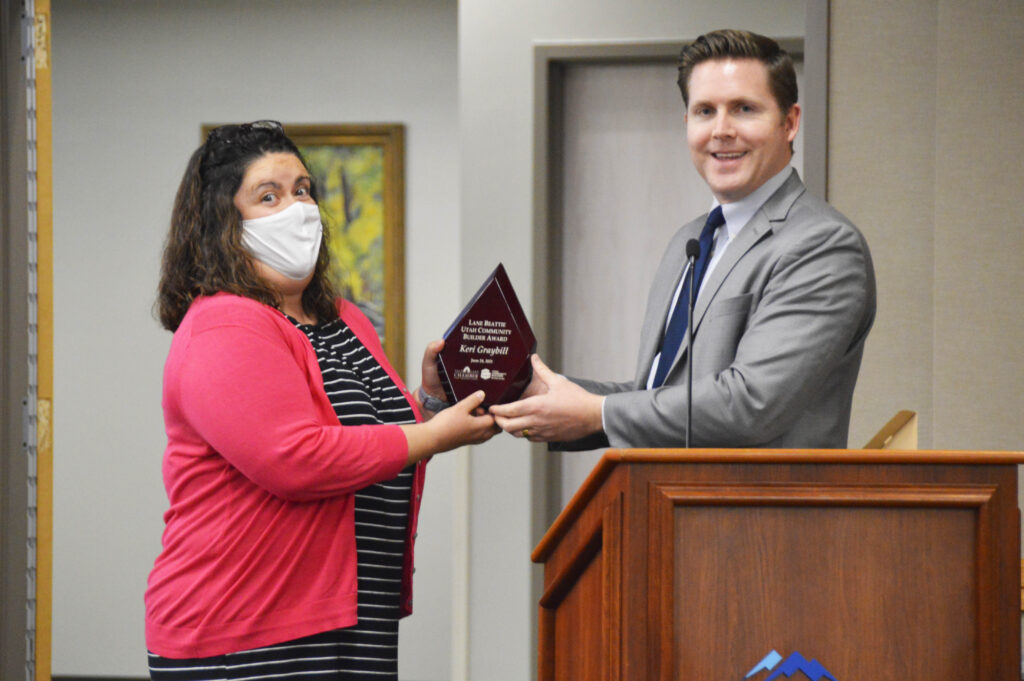 Keri Graybill receives award during board meeting