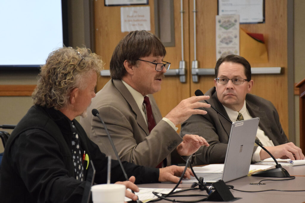 Administrators present information during board meeting