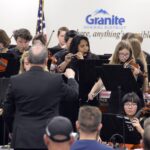 Granite Youth Symphony members perform at board meeting