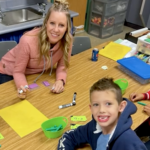 Wright Elementary teacher at table with students
