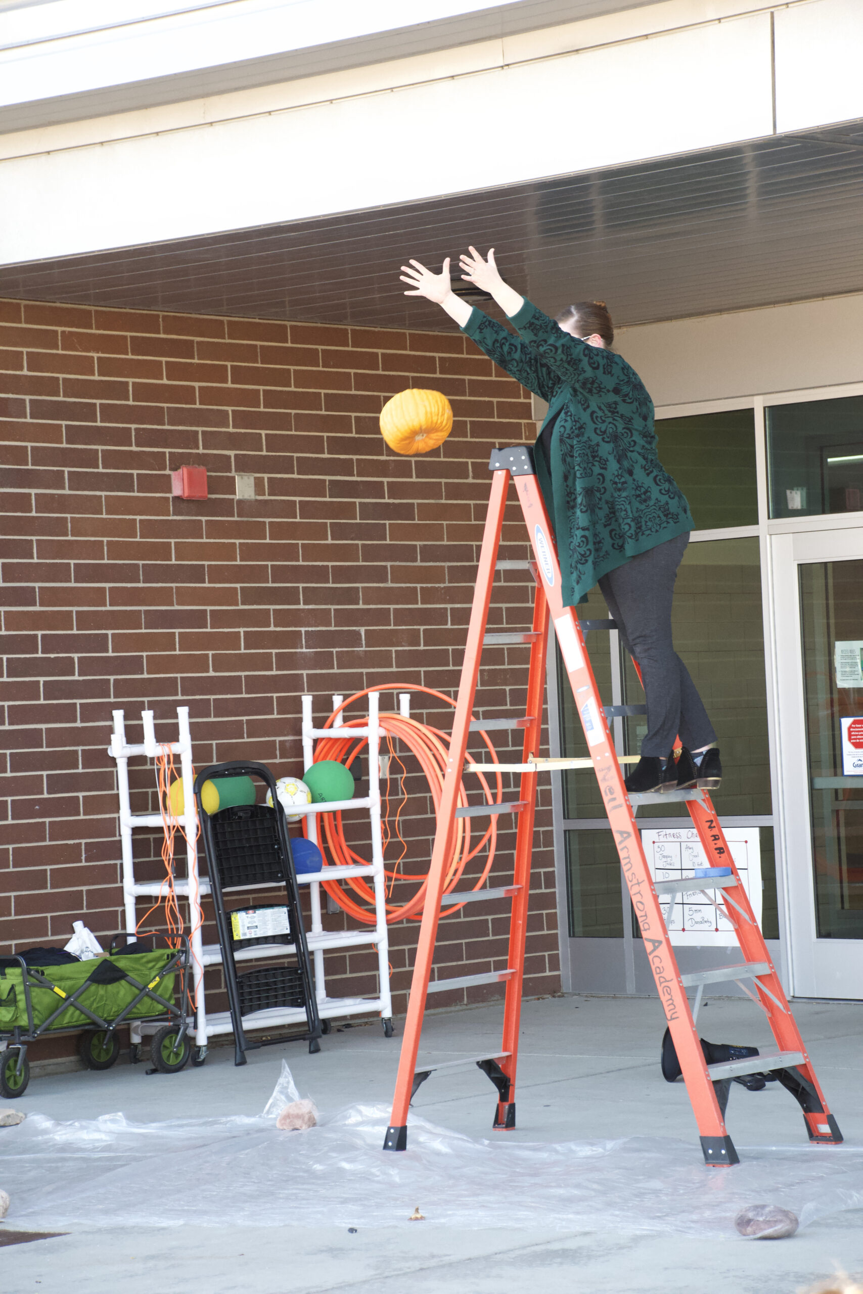Students from Neil Armstrong STEM Academy study physics by dropping pumpkins from WVCFD fire truck ladder
